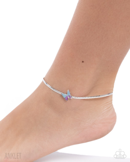 Silver anklet with a butterfly charm on a white background