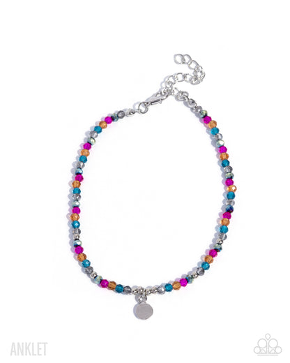 Colorful beaded anklet with silver chain on a white background