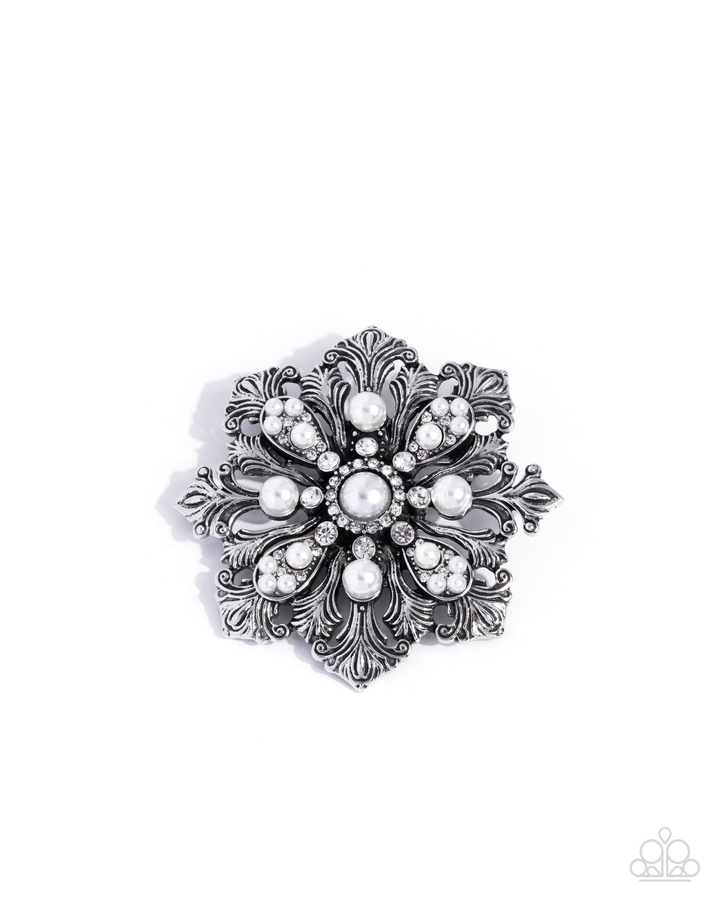 Decorative brooch with pearl-like stones on a white background