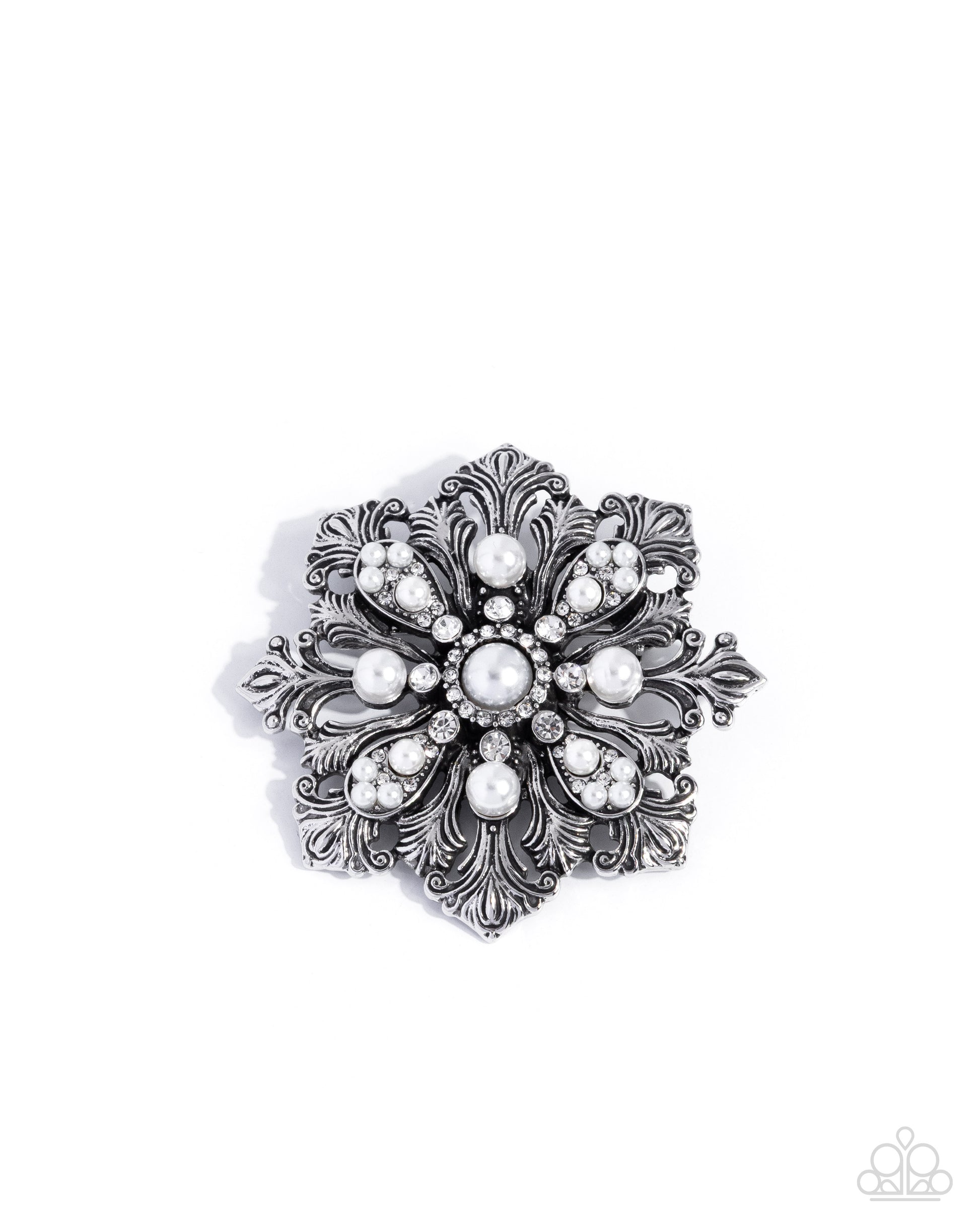 Decorative brooch with pearl-like stones on a white background