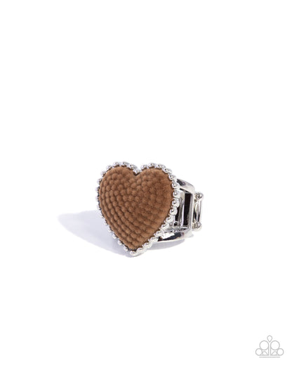Heart-shaped brown ring with silver band on a white background