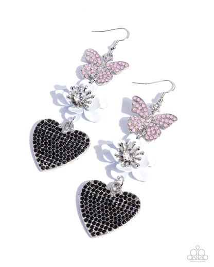 Pair of earrings with black heart and pink butterfly designs on a white background