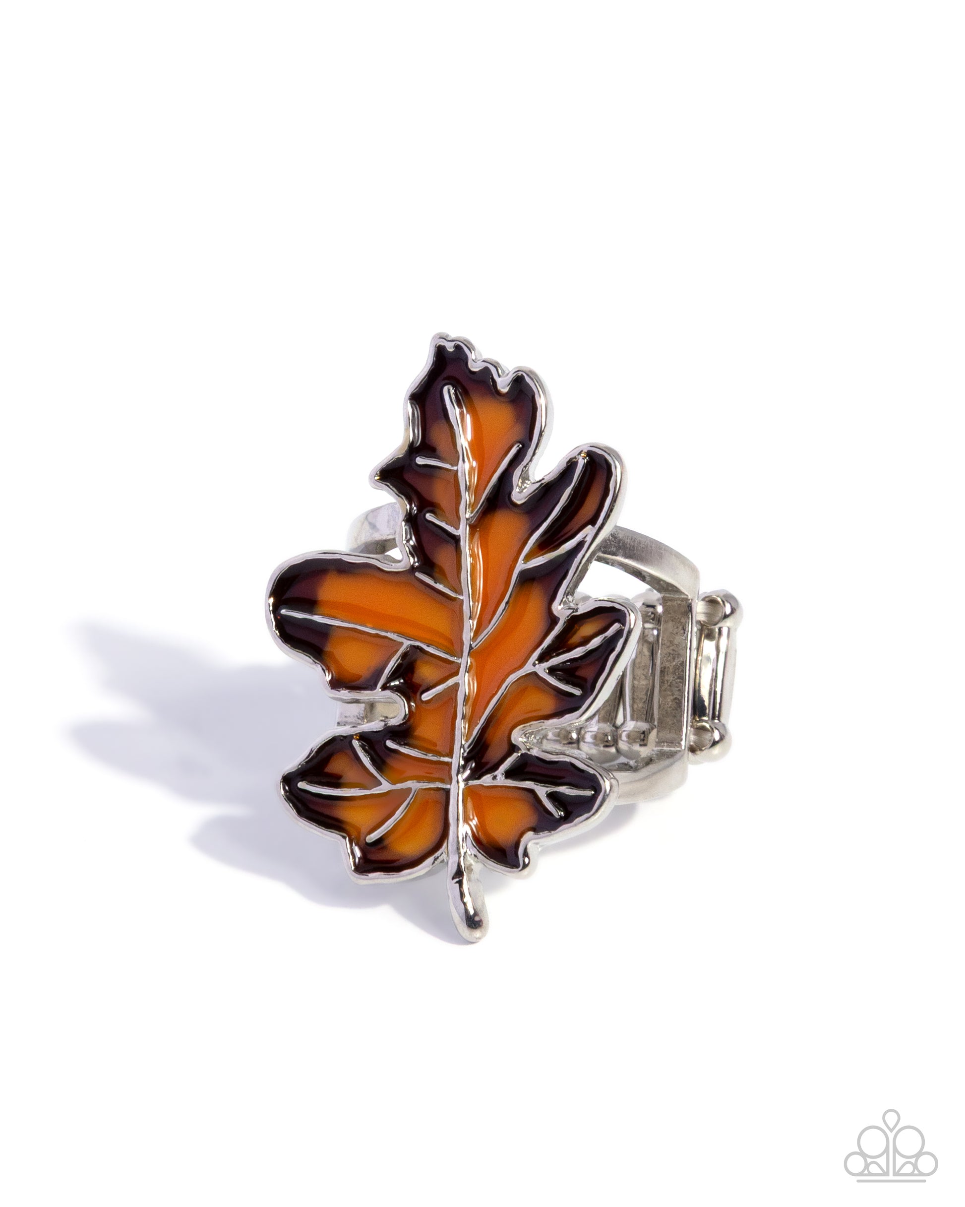 Silver ring with a brown leaf design on a white background