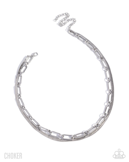 Silver choker necklace on a white background