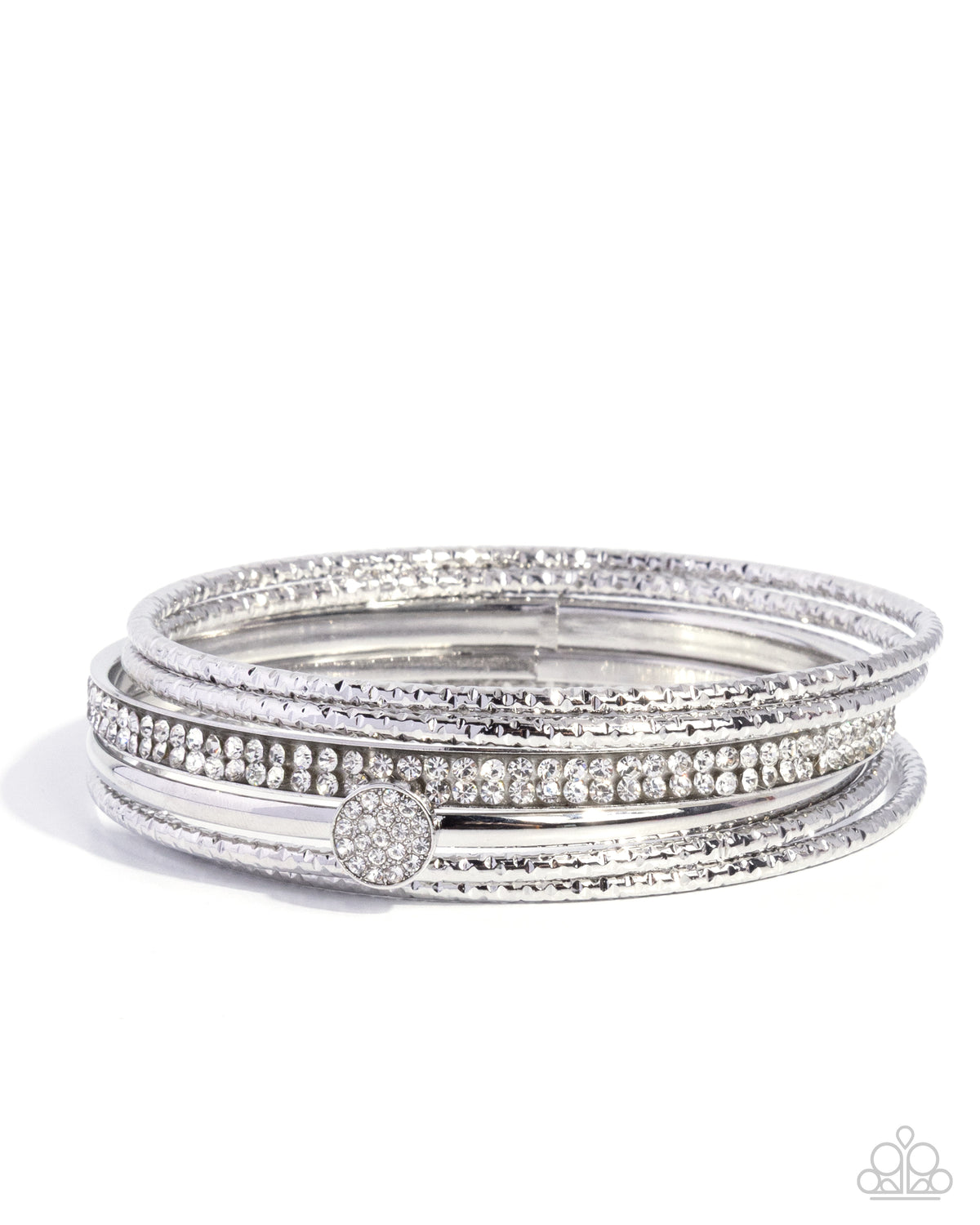 A set of five slim silver bangles stacked together, featuring rows of clear pavé stones and a central round pavé accent, on a white background.