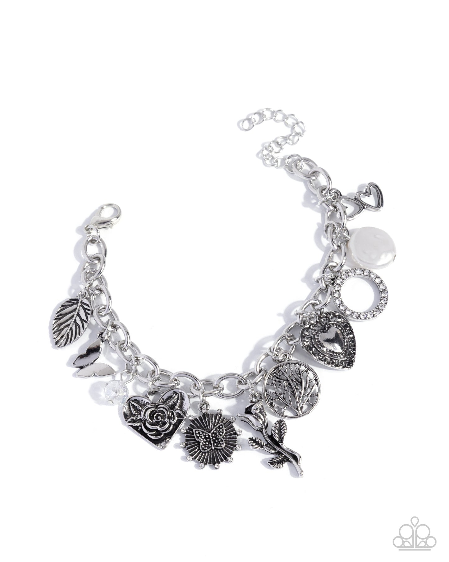 Silver charm bracelet with various charms on a white background