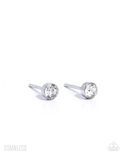 Pair of silver stud earrings with clear gemstones on a white background