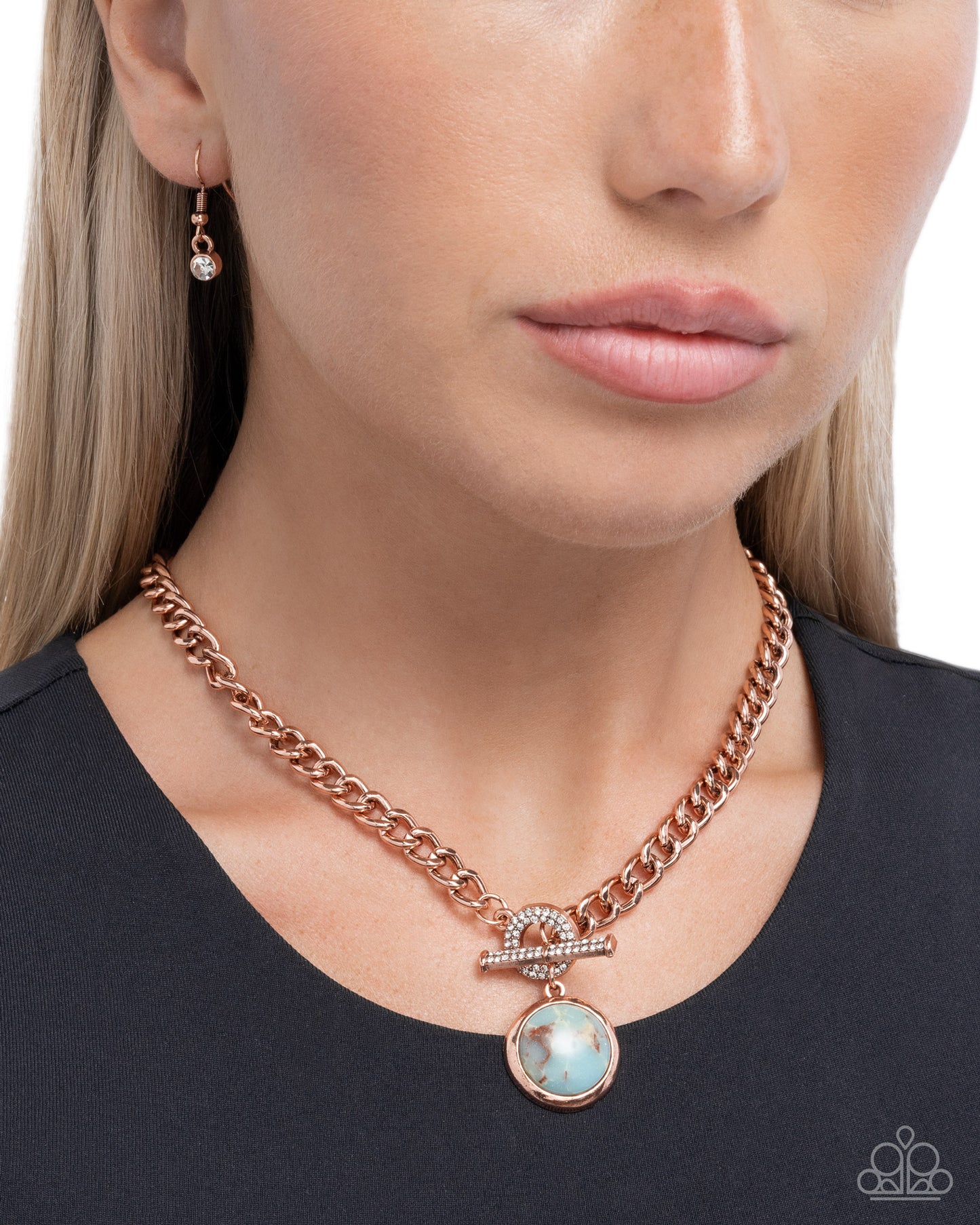 Rose gold chain necklace with a pendant worn by a model on a white background