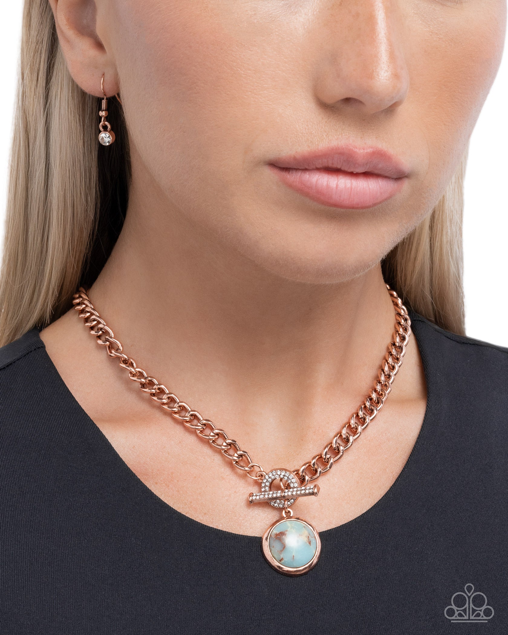 Rose gold chain necklace with a pendant worn by a model on a white background