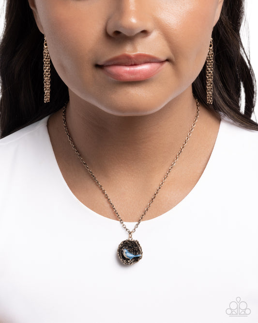Close-up of a person wearing a necklace with a pendant on a white background
