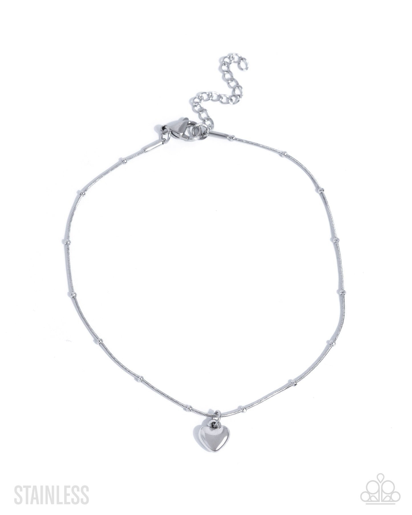 Silver anklet with a heart charm on a white background