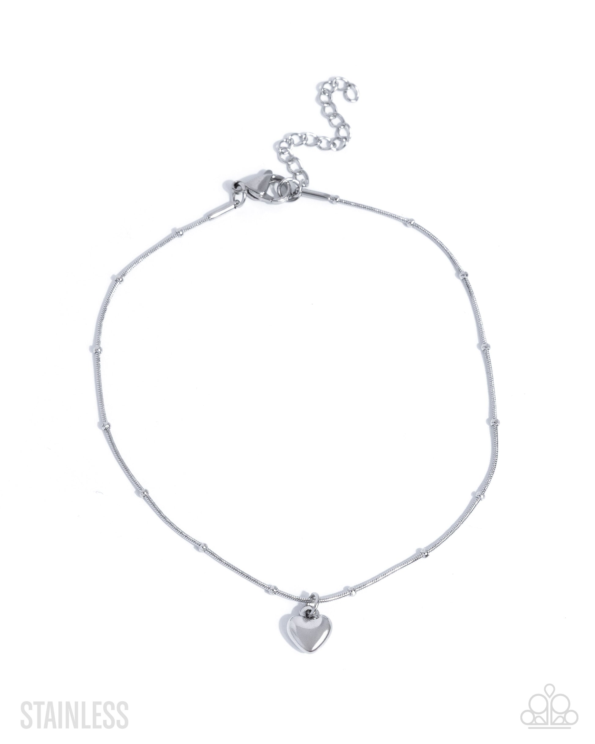 Silver anklet with a heart charm on a white background