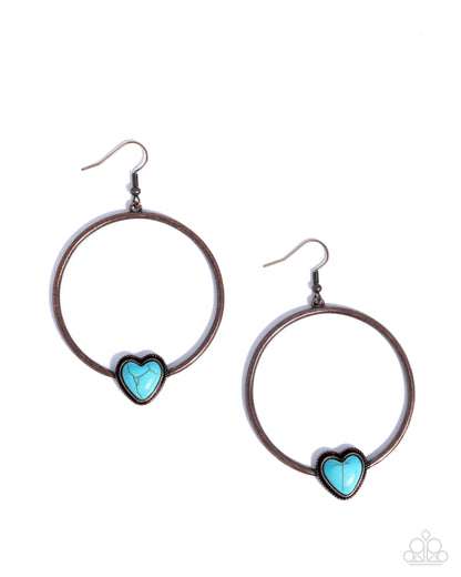 Pair of hoop earrings with turquoise heart stones on a white background