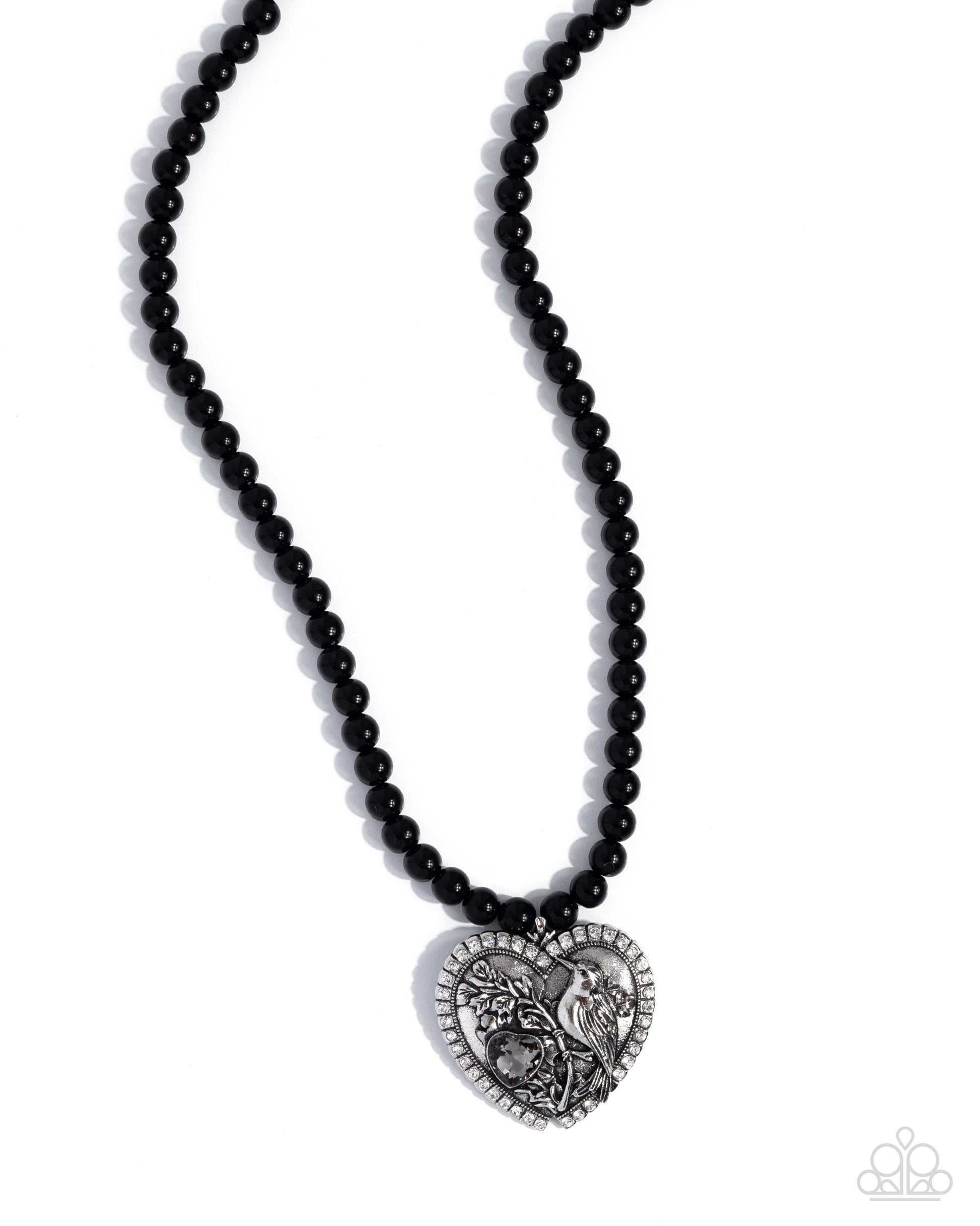 Black beaded necklace with a silver heart-shaped pendant on a white background