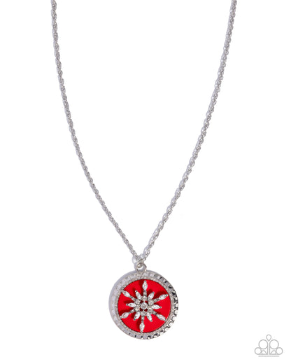 Necklace with a red pendant and silver chain on a white background