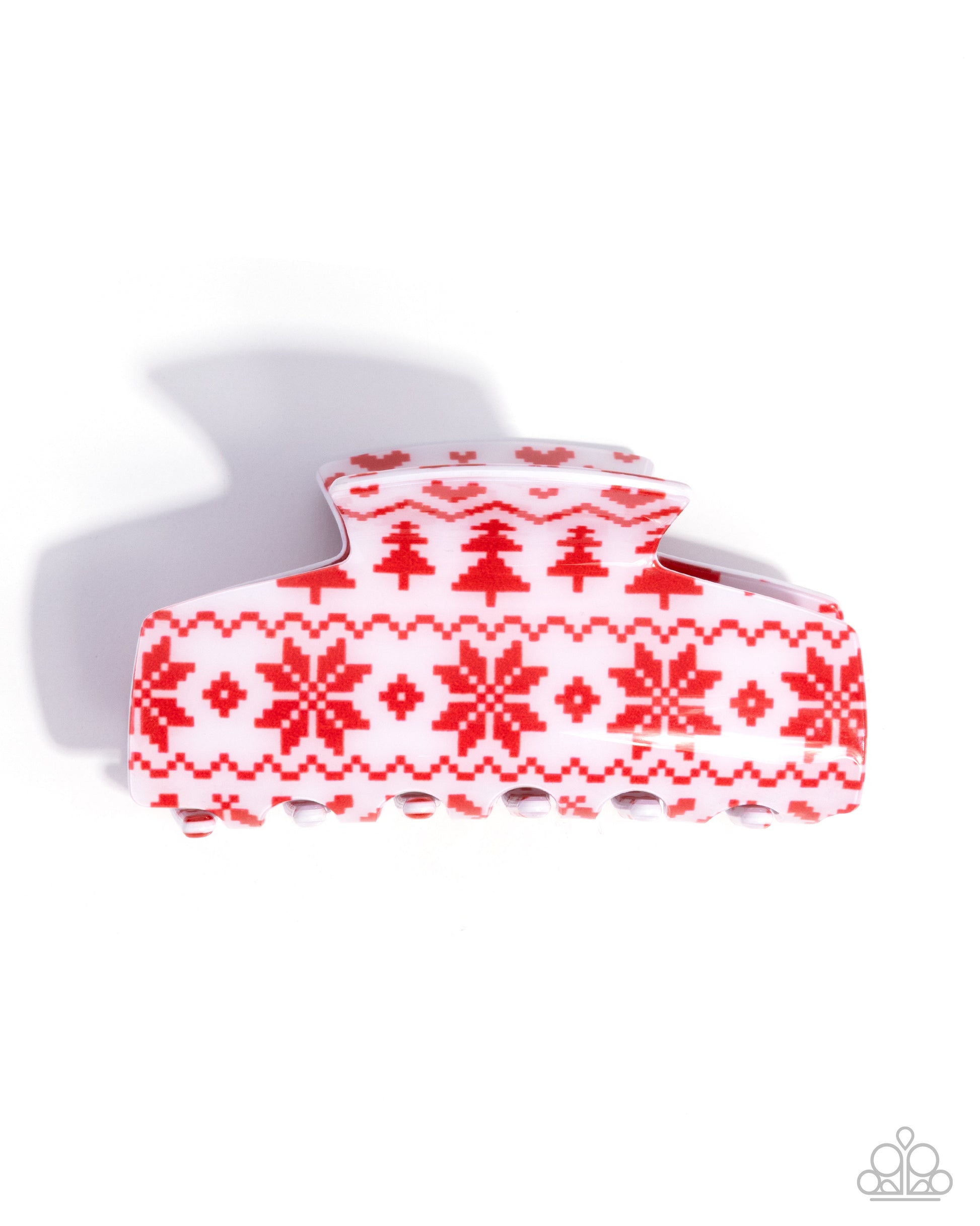 Red and white patterned hair clip on a white background