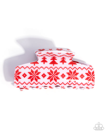 Red and white patterned hair clip on a white background