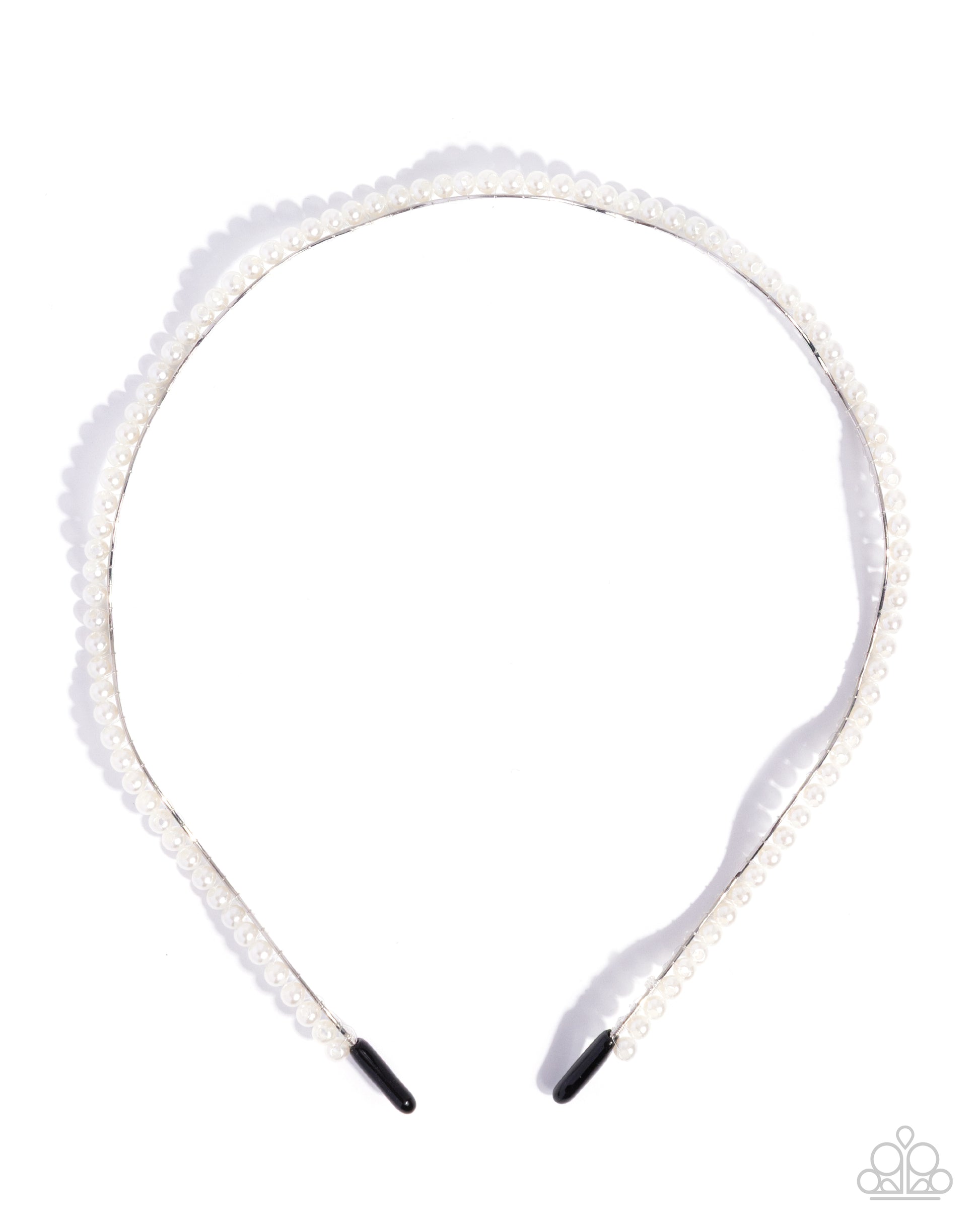 White headband with decorative elements on a white background