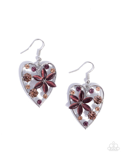 Heart-shaped earrings with floral designs on a white background