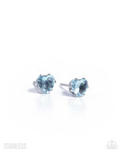 Heart-shaped blue gemstone stud earrings on a white background