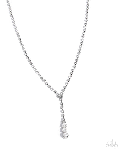 Silver necklace with a teardrop pendant on a white background