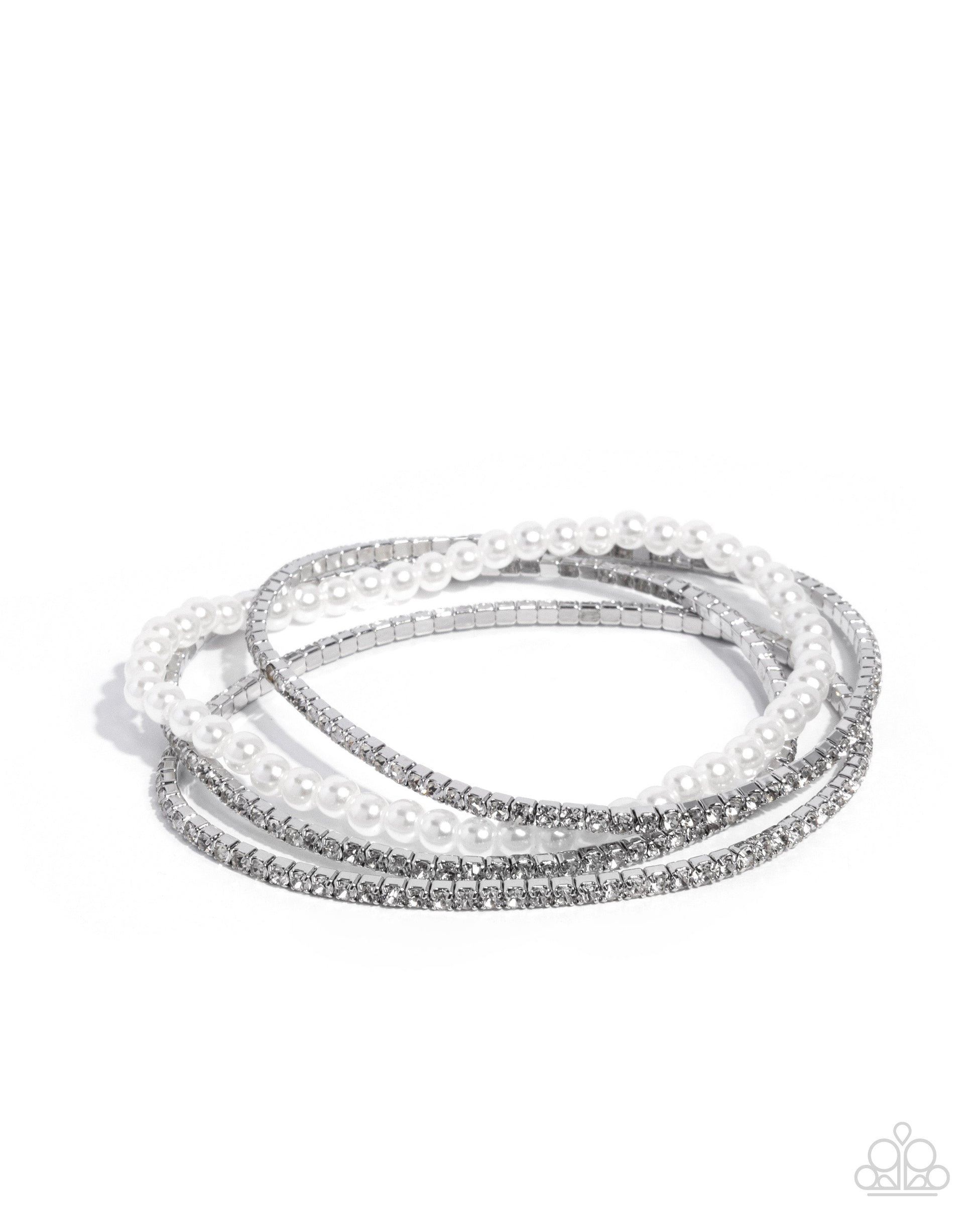 Set of three silver and white beaded bracelets on a white background