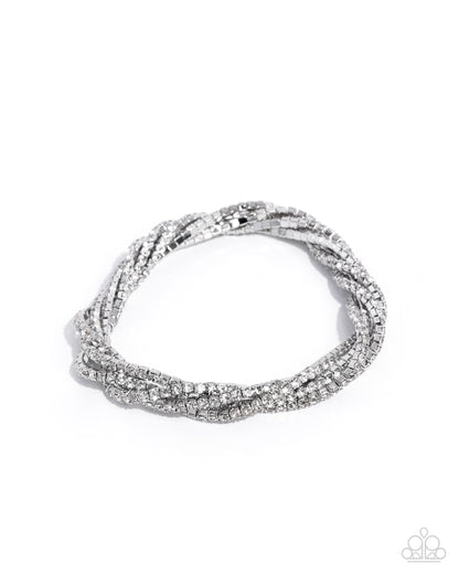 Silver bracelet with clear stones on a white background