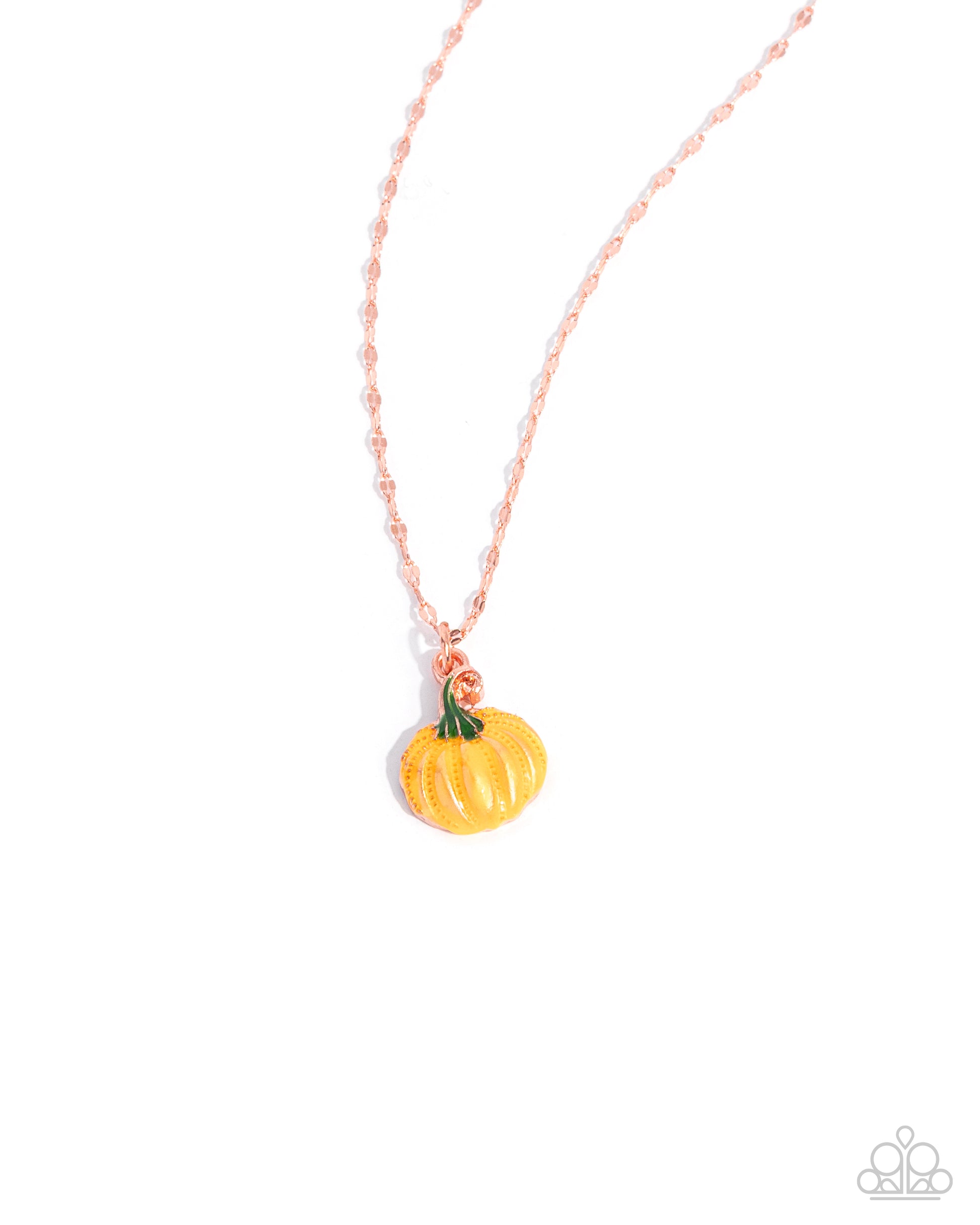Pumpkin-shaped pendant on a pink chain against a white background