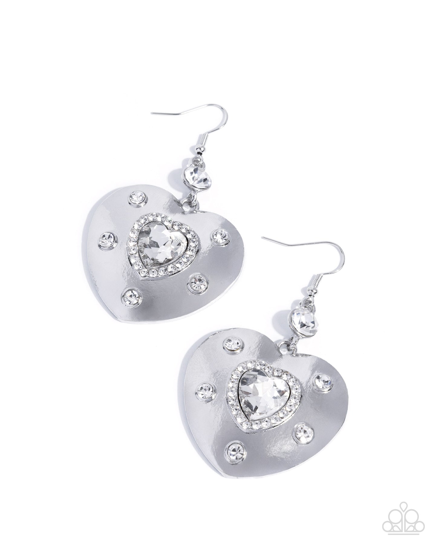 Heart-shaped silver earrings with clear gemstones on a white background
