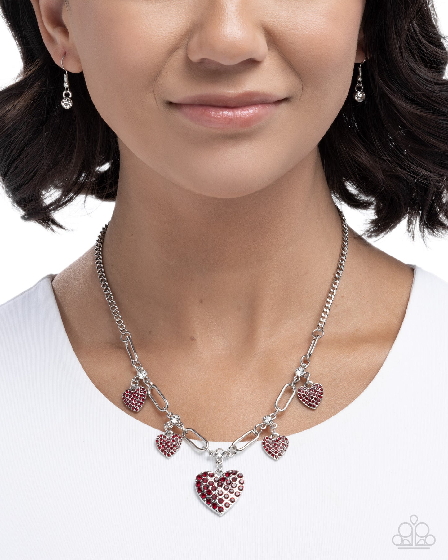Necklace with heart-shaped charms worn by a model on a white background