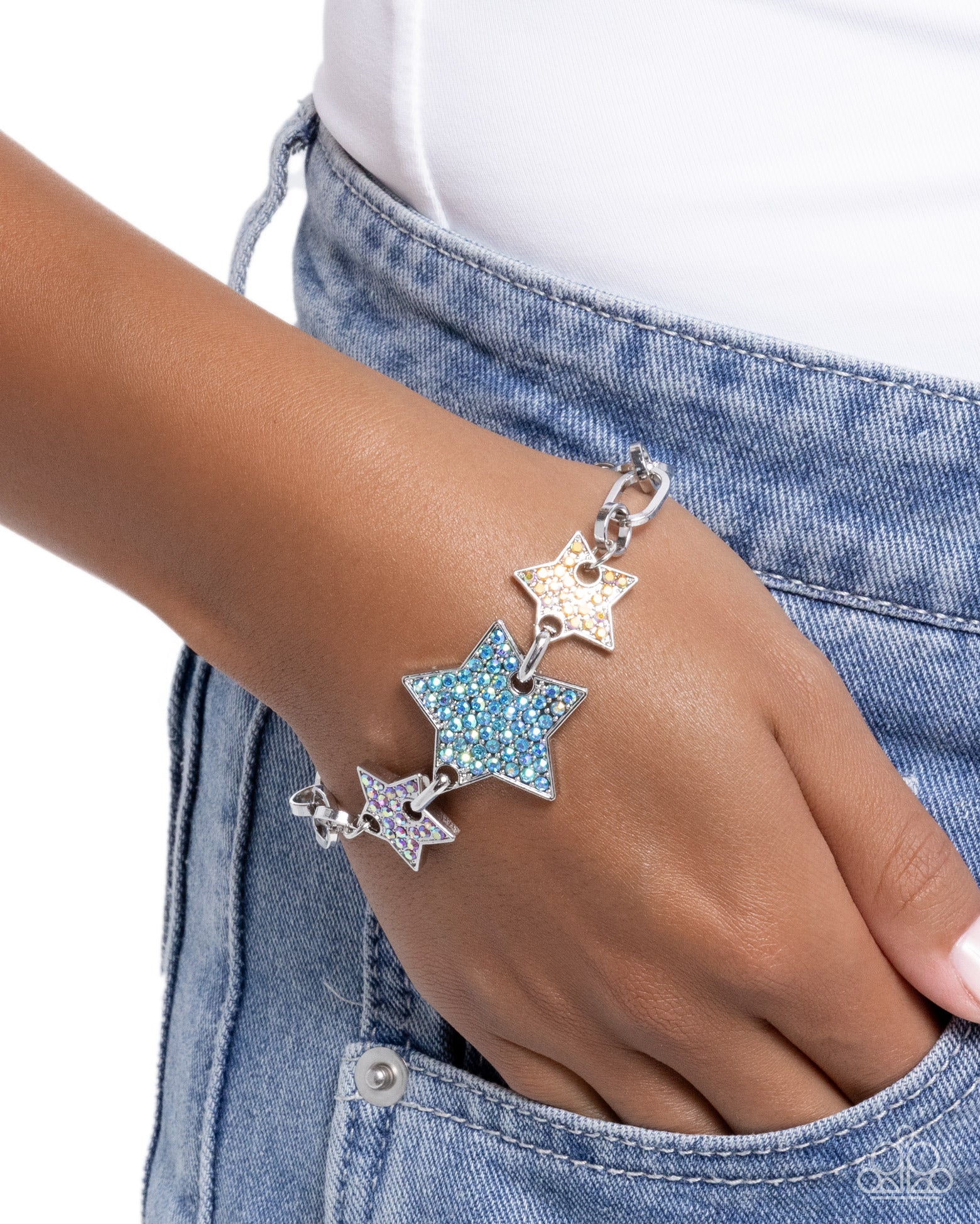 Star-shaped bracelet on a wrist with a denim background