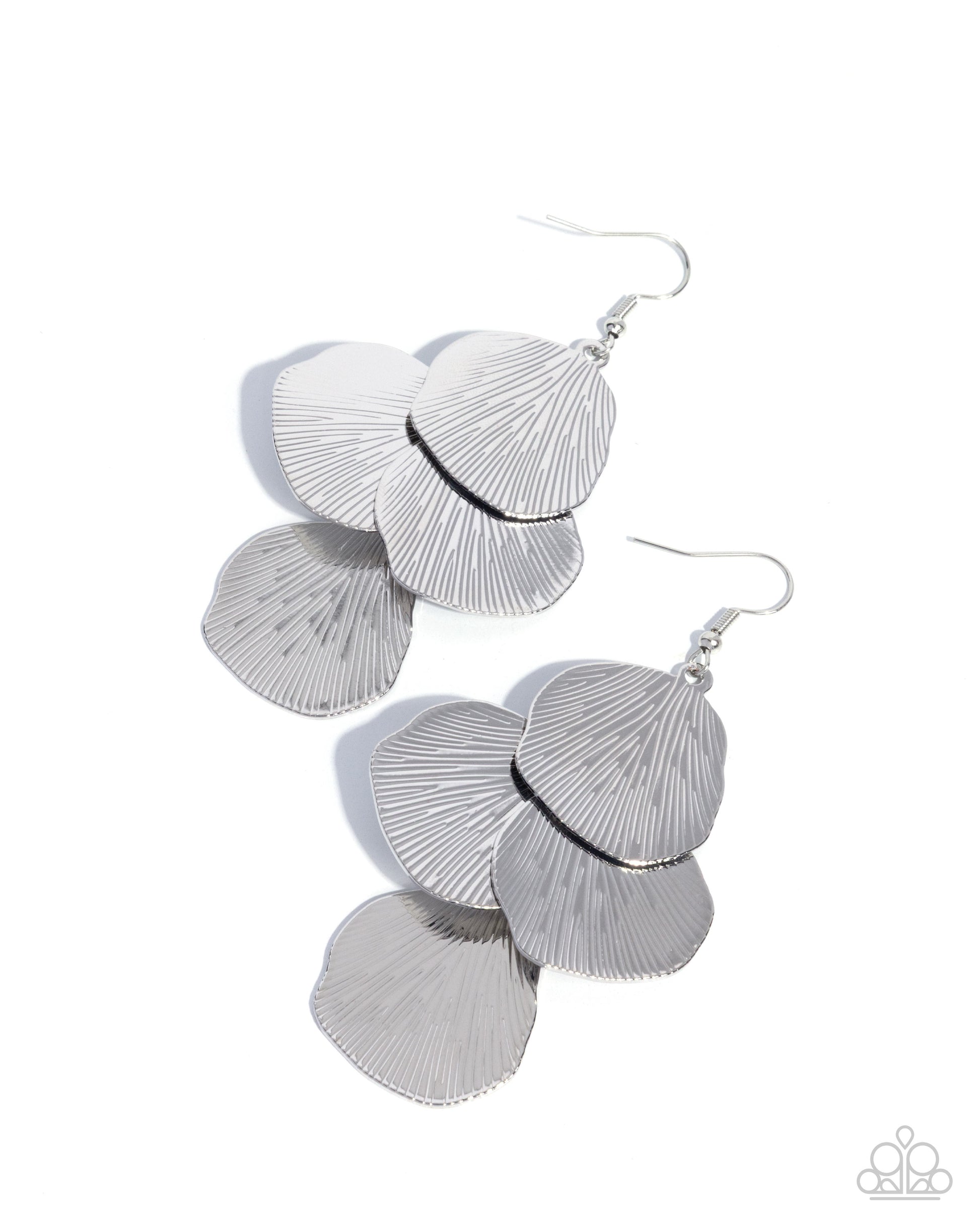 A pair of silver drop earrings with layered, fan-shaped textured metal pieces and fishhook wires, shown on a plain white background.