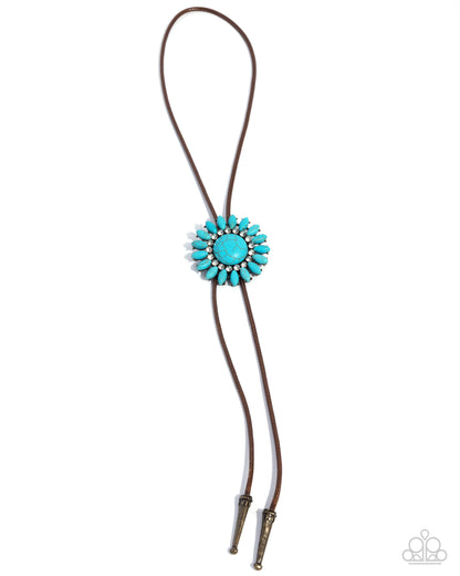Turquoise bolo tie with brown leather strap on a white background