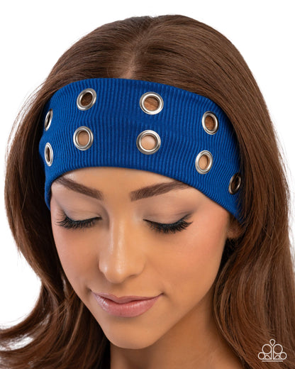 Blue headband with grommets worn by a model on a white background