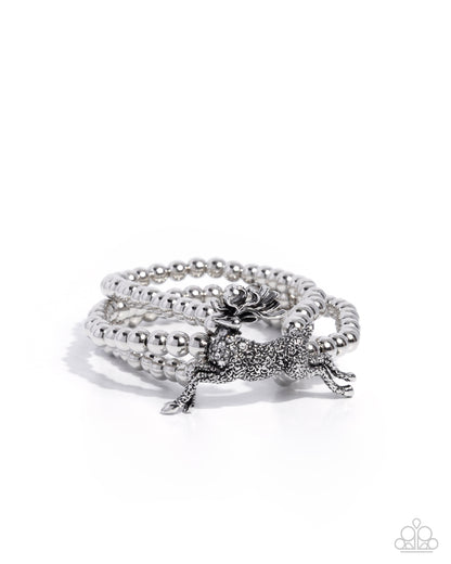 Silver bracelet with a starfish charm on a white background