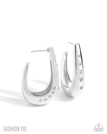 Silver hoop earrings with gemstones on a white background