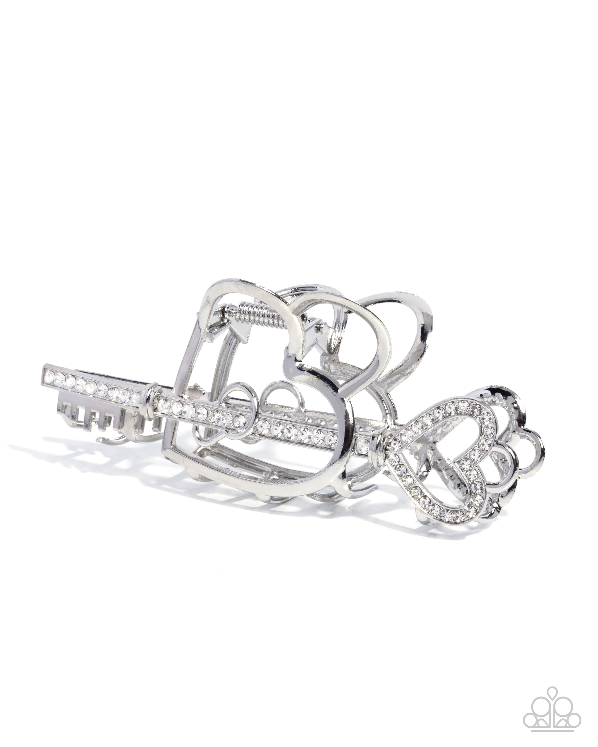 Silver hair clip with heart and bow design on a white background