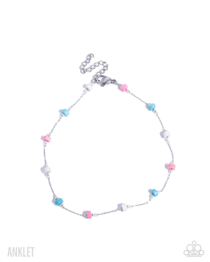 Colorful beaded anklet on a white background