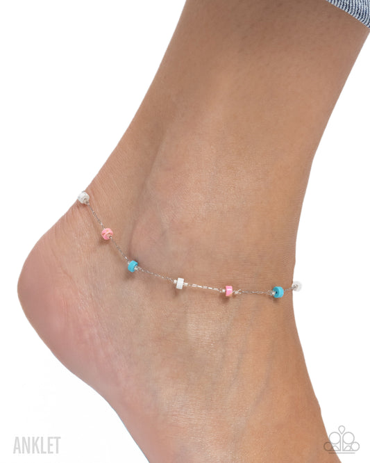 Ankle bracelet with colorful beads on a white background