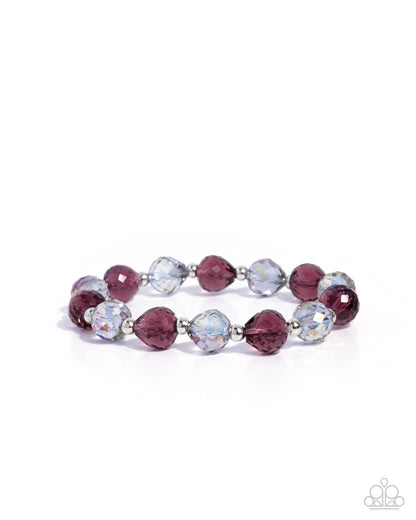 Bracelet with purple and clear beads on a white background