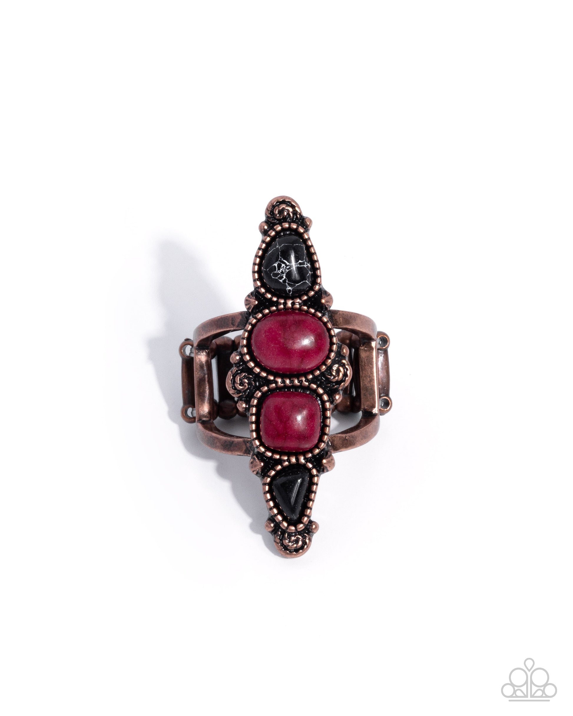 Decorative ring with pink and black stones on a white background