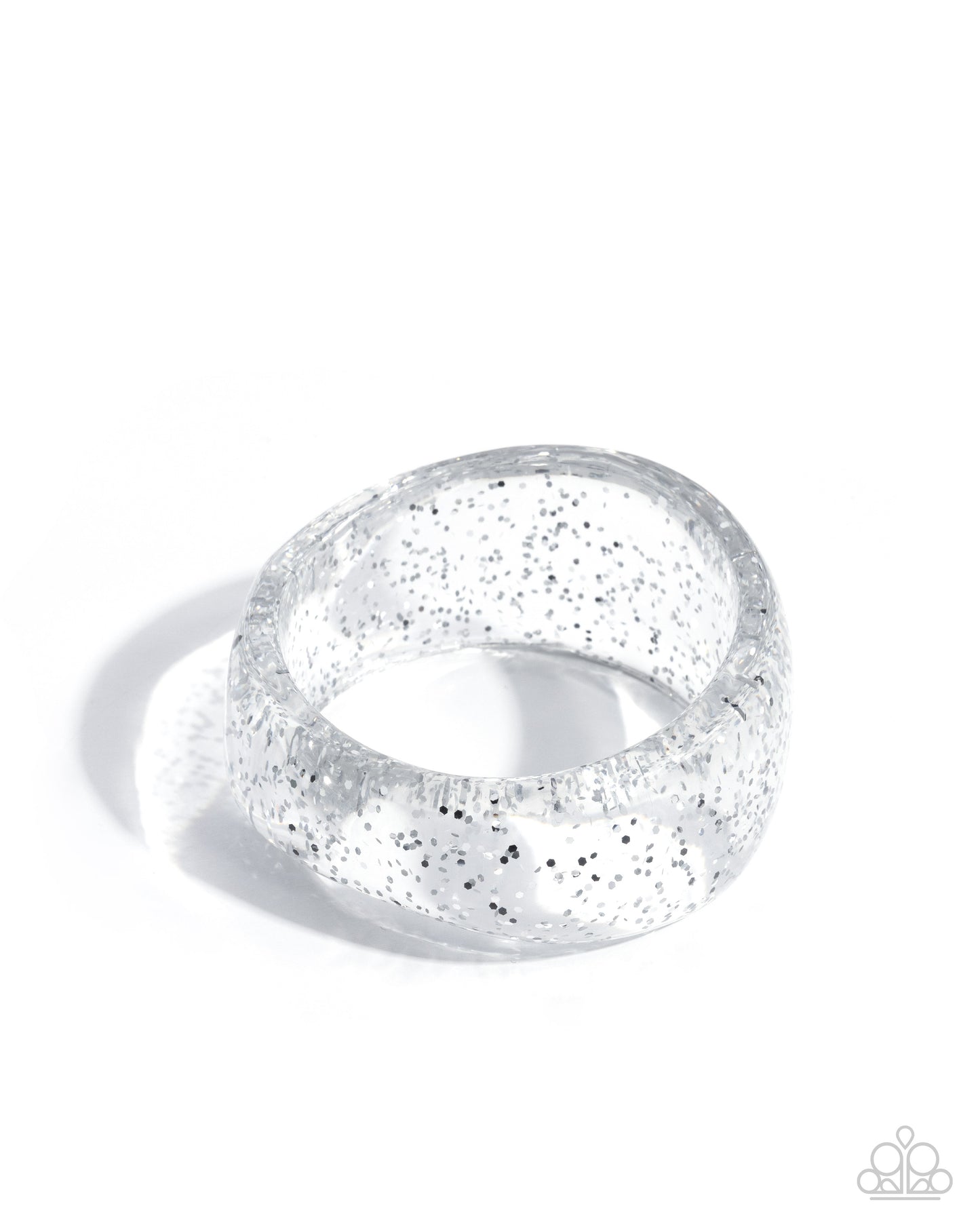 Silver ring with glittery texture on a white background