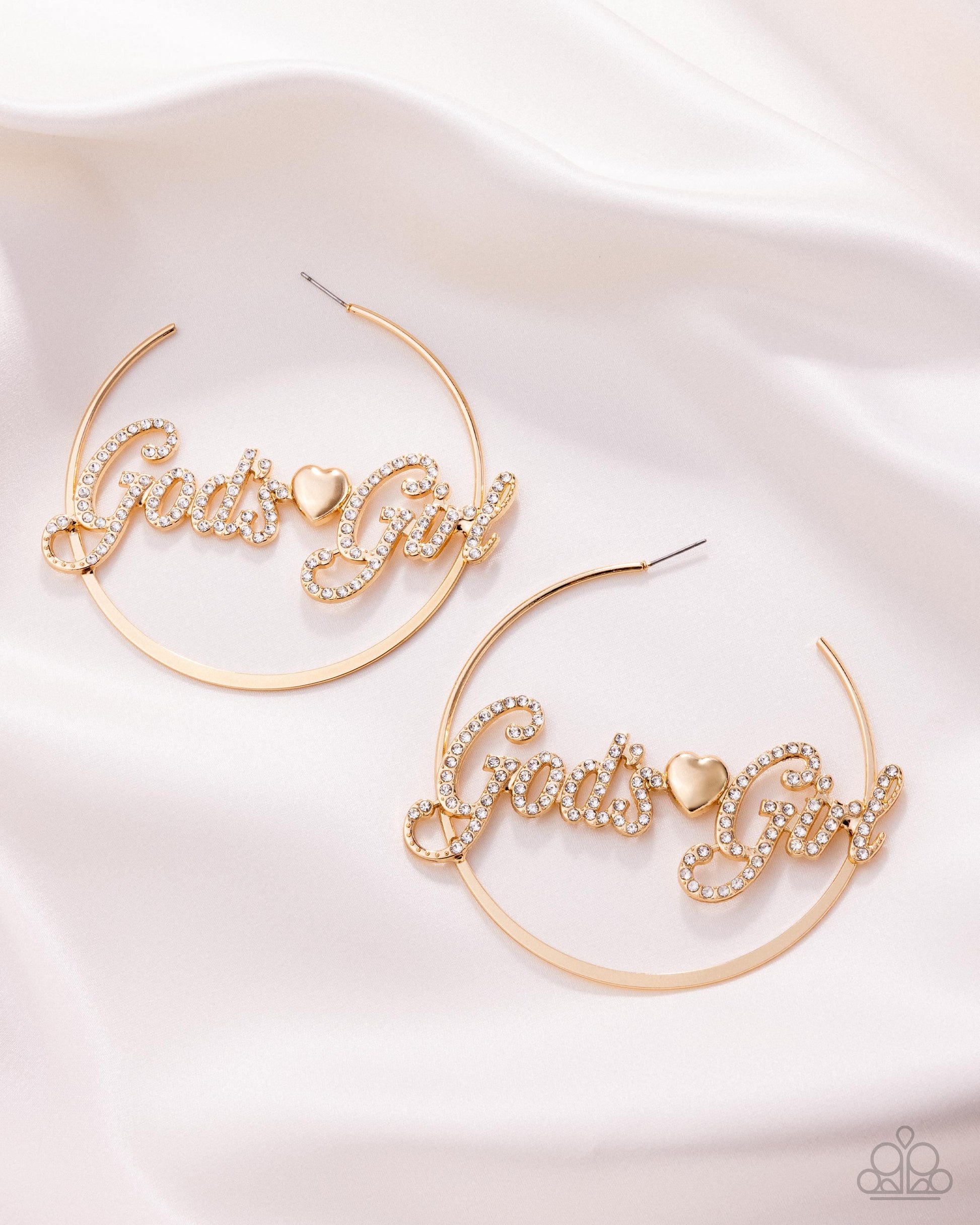 Gold hoop earrings with 'Girl of My Heart' text on a white background