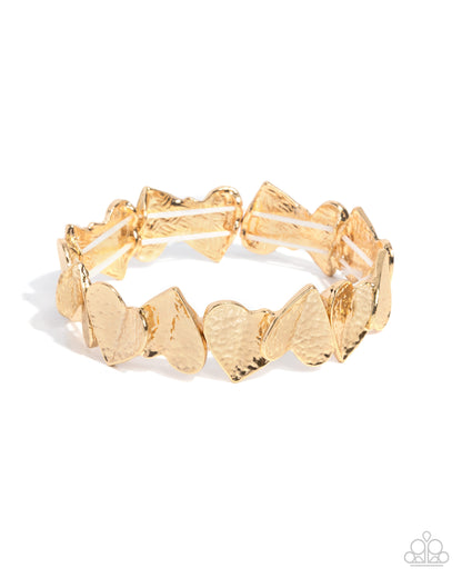 Gold bracelet with heart-shaped links on a white background
