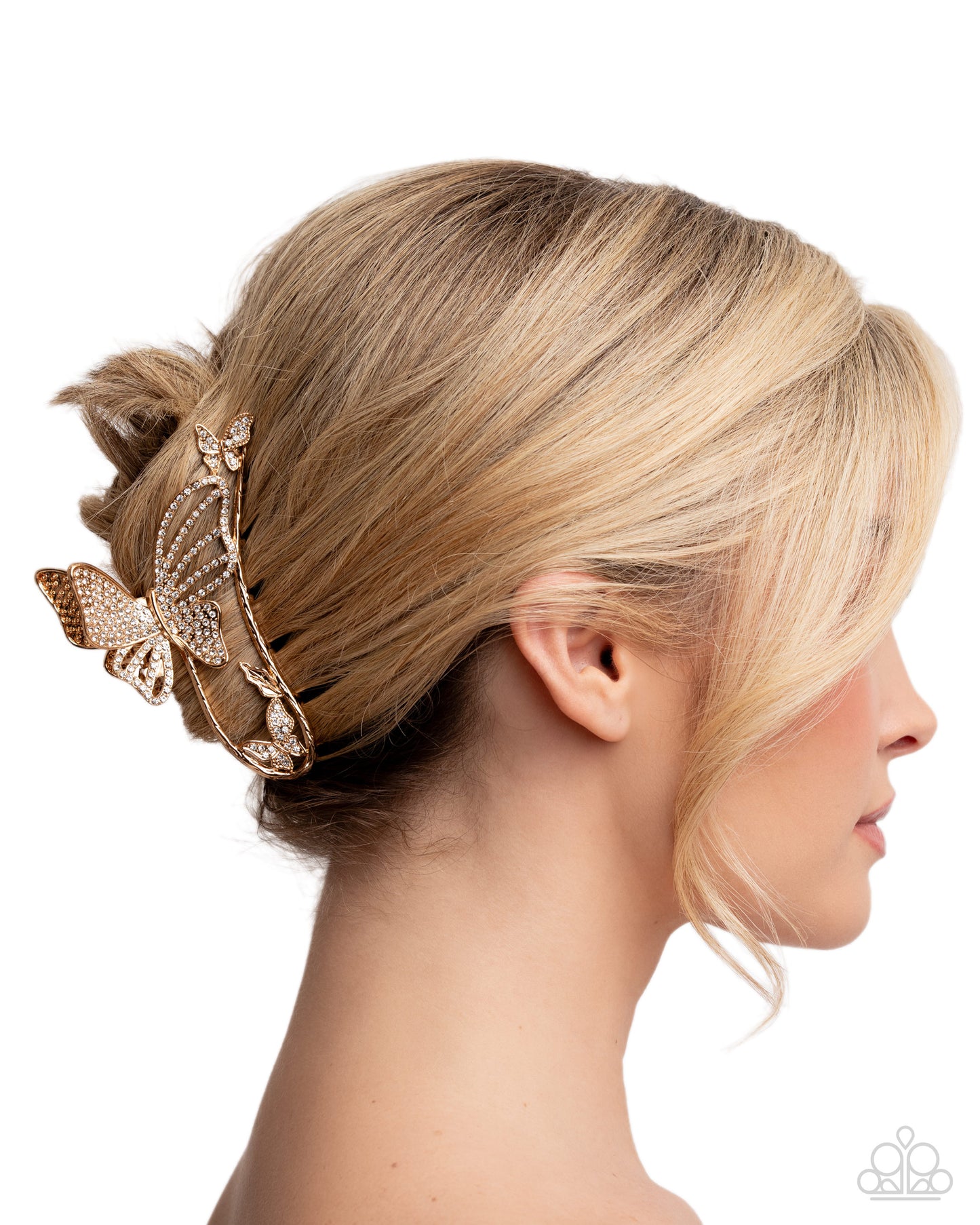 Blonde hair styled with a decorative hairpiece on a white background