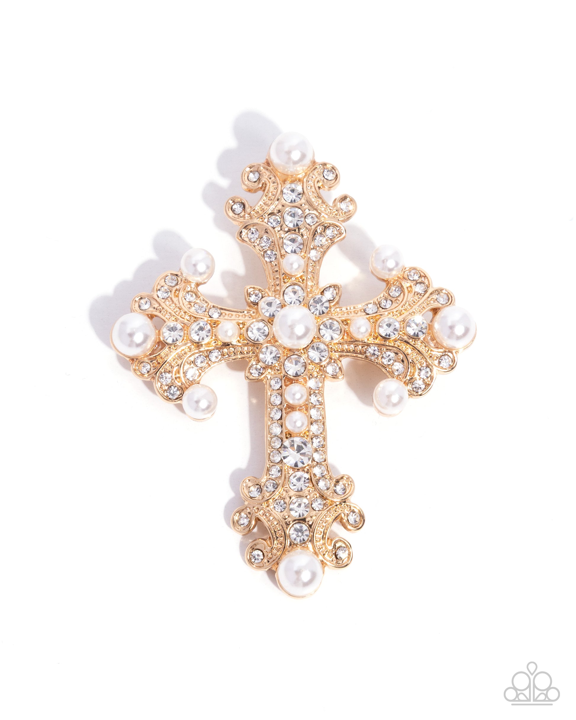 Gold cross brooch with pearls and crystals on a white background