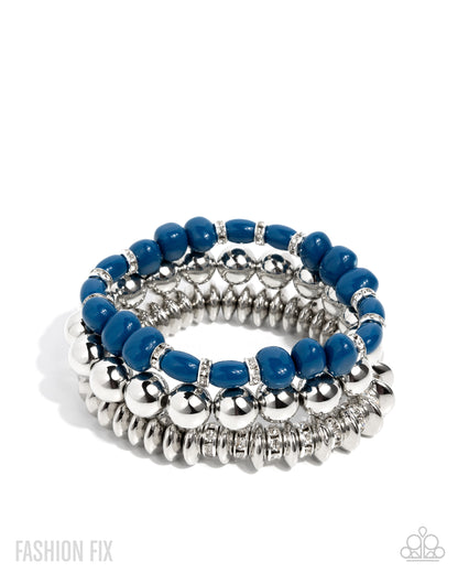 Set of blue and silver beaded bracelets on a white background