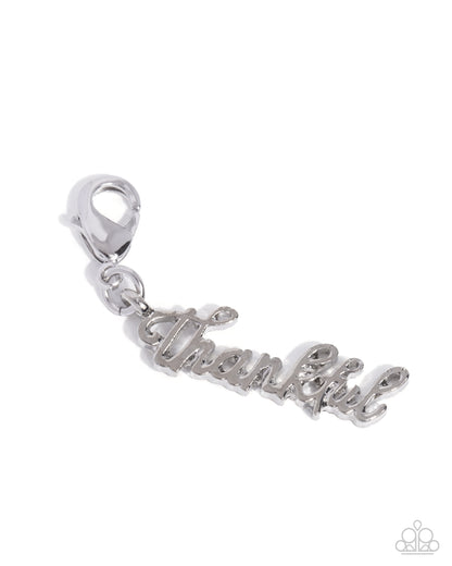 Silver 'Thankful' charm on a white background