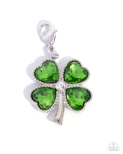 Green four-leaf clover charm with silver accents on a white background