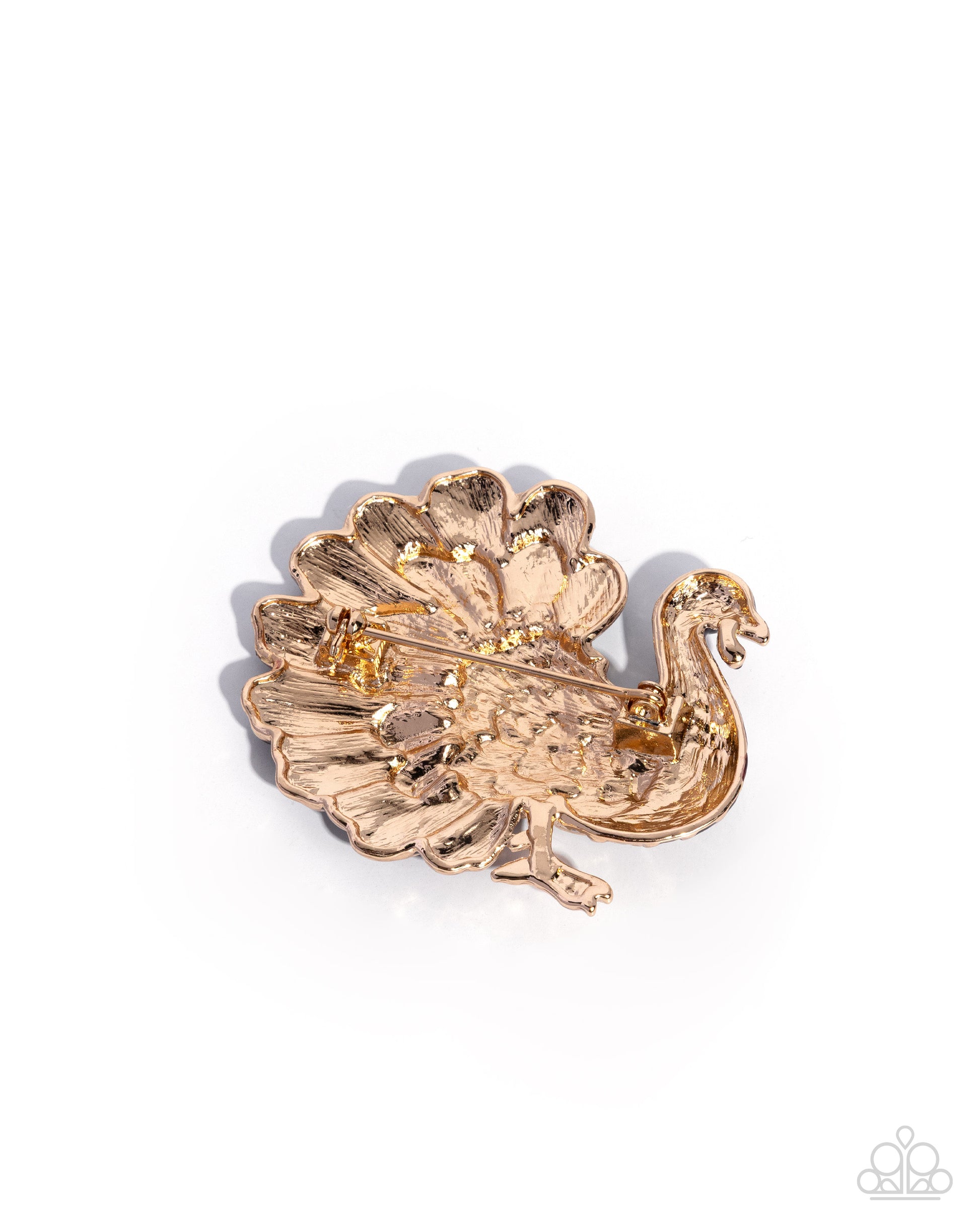 Gold peacock brooch on a white background
